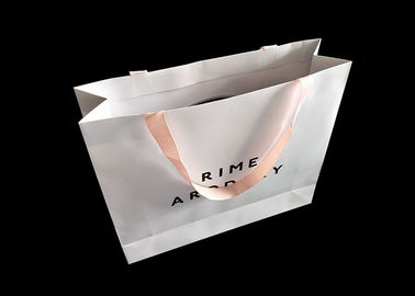 चीन Foldable कस्टम मुद्रित बैग, रिबन हैंडल लक्जरी के साथ बुटीक शॉपिंग बैग फैक्टरी